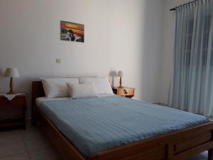 Llit o llits en una habitació de Hotel Paradisos Oia