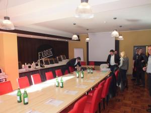 a group of people standing around a long table at Hotel Fabrik Vösendorf in Vösendorf