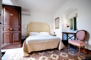 Postel nebo postele na pokoji v ubytování Sveva rooms