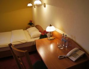 Postel nebo postele na pokoji v ubytování Hotel Na Błoniach + 37 fotografií