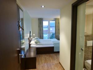 Postel nebo postele na pokoji v ubytování Hotel Evering