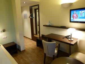 TV a/nebo společenská místnost v ubytování Hotel Evering
