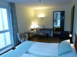 Postel nebo postele na pokoji v ubytování Hotel Evering