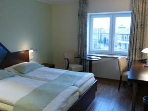 Postel nebo postele na pokoji v ubytování Hotel Evering