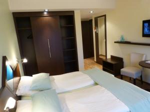 Postel nebo postele na pokoji v ubytování Hotel Evering