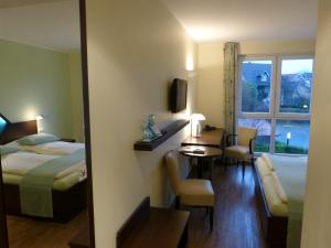 Postel nebo postele na pokoji v ubytování Hotel Evering