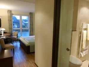 Postel nebo postele na pokoji v ubytování Hotel Evering