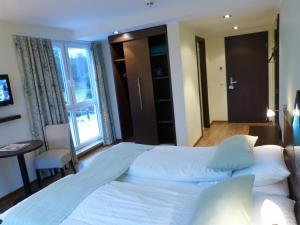 Postel nebo postele na pokoji v ubytování Hotel Evering