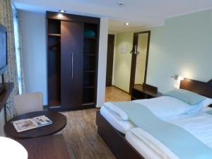 Postel nebo postele na pokoji v ubytování Hotel Evering