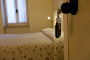 Postel nebo postele na pokoji v ubytování Alessi Hotel Trattoria