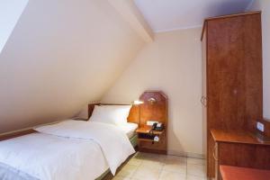 Katil atau katil-katil dalam bilik di SAN REMO Fine.Food.Hotel