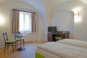 En eller flere senger på et rom på Stadthotel Waidhofen an der Thaya