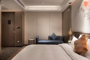 Postel nebo postele na pokoji v ubytování Paco Hotel Dongpu Guanghzou -Free Shuttle Bus for Canton Fair