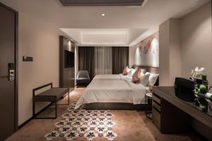 Postel nebo postele na pokoji v ubytování Paco Hotel Dongpu Guanghzou -Free Shuttle Bus for Canton Fair
