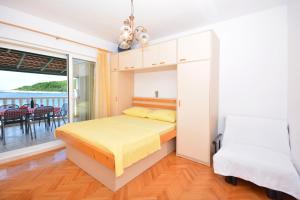 Postel nebo postele na pokoji v ubytování Apartments Regina