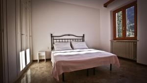 Postel nebo postele na pokoji v ubytování Casa della Vittoria