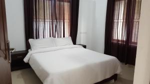 Letto o letti in una camera di The Rubis