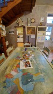 a table with a map on it in a room at Rooster Hostel in Veliko Tŭrnovo