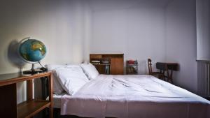 a bedroom with a bed with a globe on it at Casa della Vittoria in Maccagno Inferiore