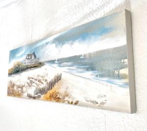 a painting of a beach with a house at Düsseldorf Comfort Apartment in Düsseldorf