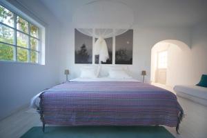 
Uma cama ou camas num quarto em Casal do Frade
