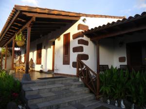 a house with a staircase leading up to it at Finca El Picacho Apartments in the countryside 2 Km from the beach in Tejina