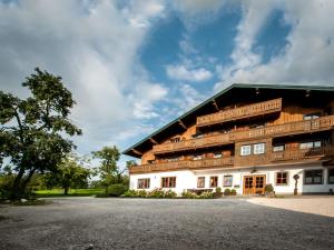 a building with balconies on the side of it at Gasthof Steinerwirt in Grossgmain