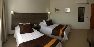 Postel nebo postele na pokoji v ubytování Conrado Hotel Osorno