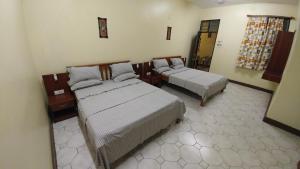 Postel nebo postele na pokoji v ubytování Marigold Guest House + 4 fotografie