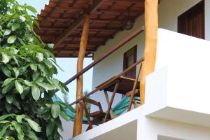 a view from the balcony of a house at Family Guest House in Ilha de Boipeba