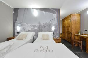 Postel nebo postele na pokoji v ubytování Mollino Rooms