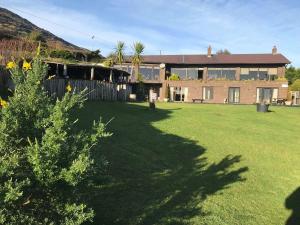 a large house with a large yard with a house at Wildwood Lodge in Carlingford
