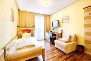 Postel nebo postele na pokoji v ubytování Revita Hotel Kocher