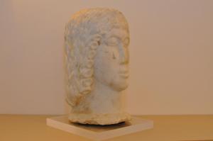 a statue of a head sitting on a table at Casa Mao in Amalfi