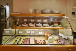 a display case with food items on display at Hotel Hirschen in Zürich