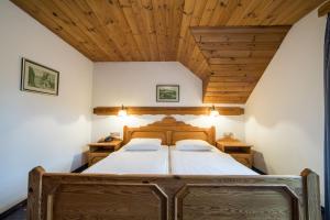 Postel nebo postele na pokoji v ubytování Garni Hotel Berc