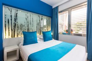 Postel nebo postele na pokoji v ubytování JC Hotel + 37 fotografií