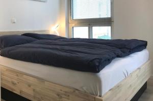 Postel nebo postele na pokoji v ubytování Apartment Warnemünde 11