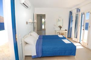 a bedroom with a bed and a view of the ocean at Dream Island Hotel in Livadia