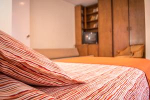Postel nebo postele na pokoji v ubytování GHL casa hotel