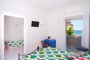 A bed or beds in a room at Hotel Le Terrazze