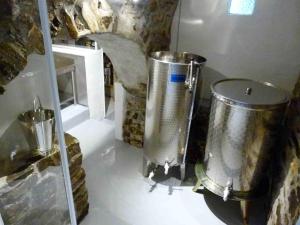 a kitchen with two large silver containers on the floor at Un Posto al Sole in Diano San Pietro +79 photos