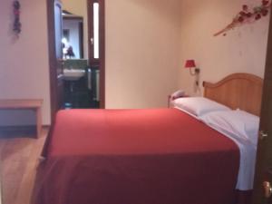 Postel nebo postele na pokoji v ubytování Albergo Arinde