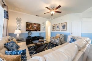a living room with a couch and a ceiling fan at Beechfield Villa 7829 in Orlando