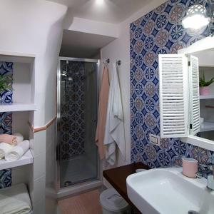 a bathroom with a shower and a sink at Kallion house in Vietri sul Mare