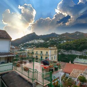 a view of a city with buildings and mountains at Kallion house in Vietri sul Mare