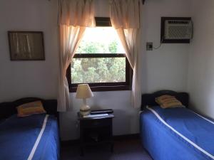 Postel nebo postele na pokoji v ubytování Pousada Fazenda Pinhalzinho + 37 fotografií