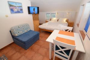 Postel nebo postele na pokoji v ubytování Maritimo Apartments