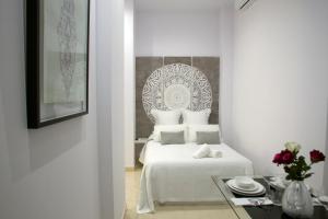 Ένα ή περισσότερα κρεβάτια σε δωμάτιο στο Panther Home Luxury Dreams Sevilla