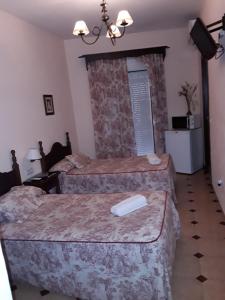 Ein Bett oder Betten in einem Zimmer der Unterkunft Hostal Rocio